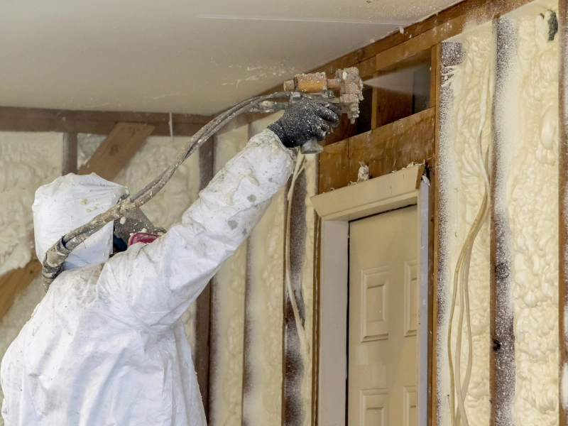 insulation contractor using foam spary during insulation installation new castle de